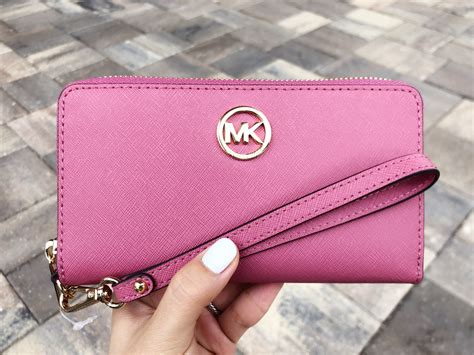 michael kors pink wristlet wallet.